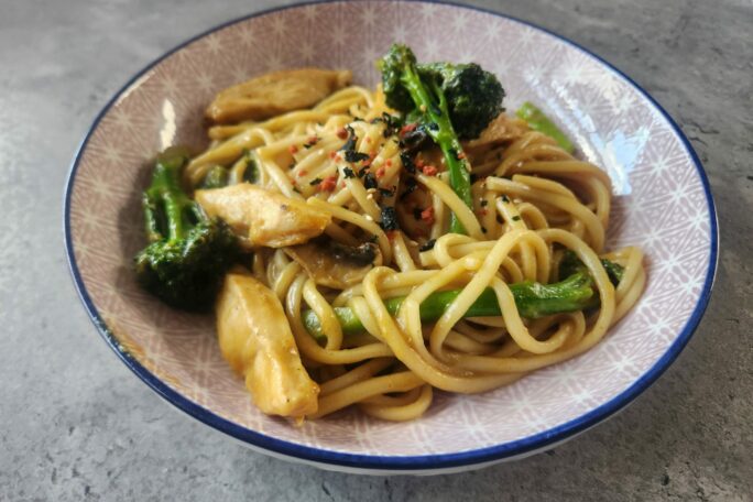Stir-fry curry chicken udon with broccolini