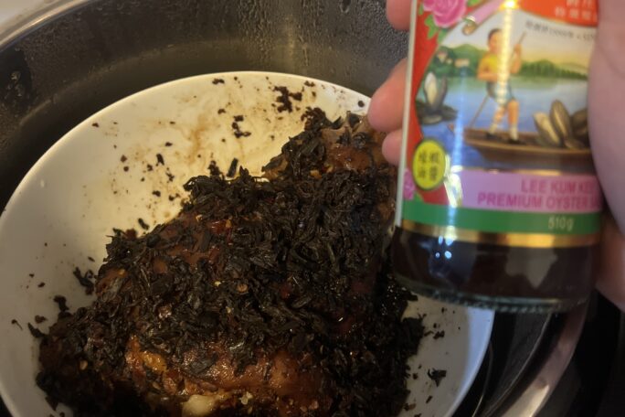 Spicy steamed pork knuckle with preserved mustard greens