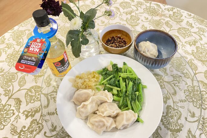 Pork and cabbage dumplings, with sauteed mustard leaf and chilli soy dipping sauce