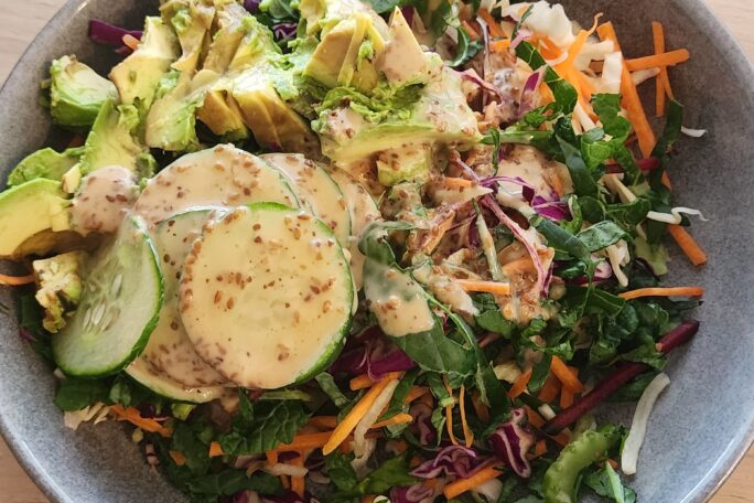 Roasted sesame kaleslaw with avocado and cucumber