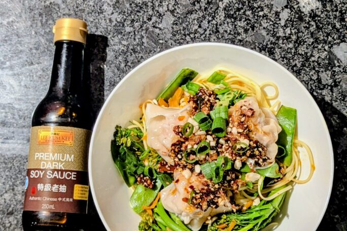 Szechuan chilli oil wontons on golden noodle stir fry