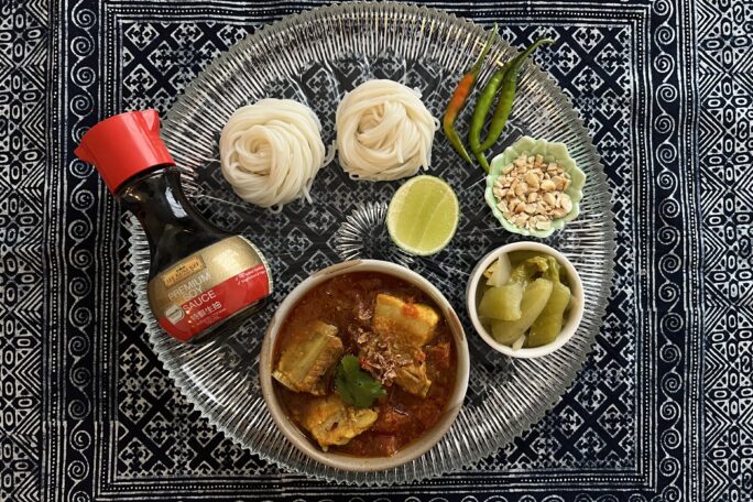 Shan-style noodles with spicy pork stew (Kanom Jeen Nam Ngiaw)
