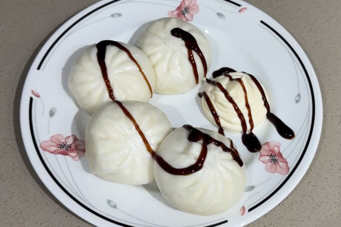 BBQ pork buns with a drizzle of thick teriyaki sauce and kewpie mayonnaise
